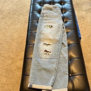 Cute INC jeans with leopard or cheetah patches.